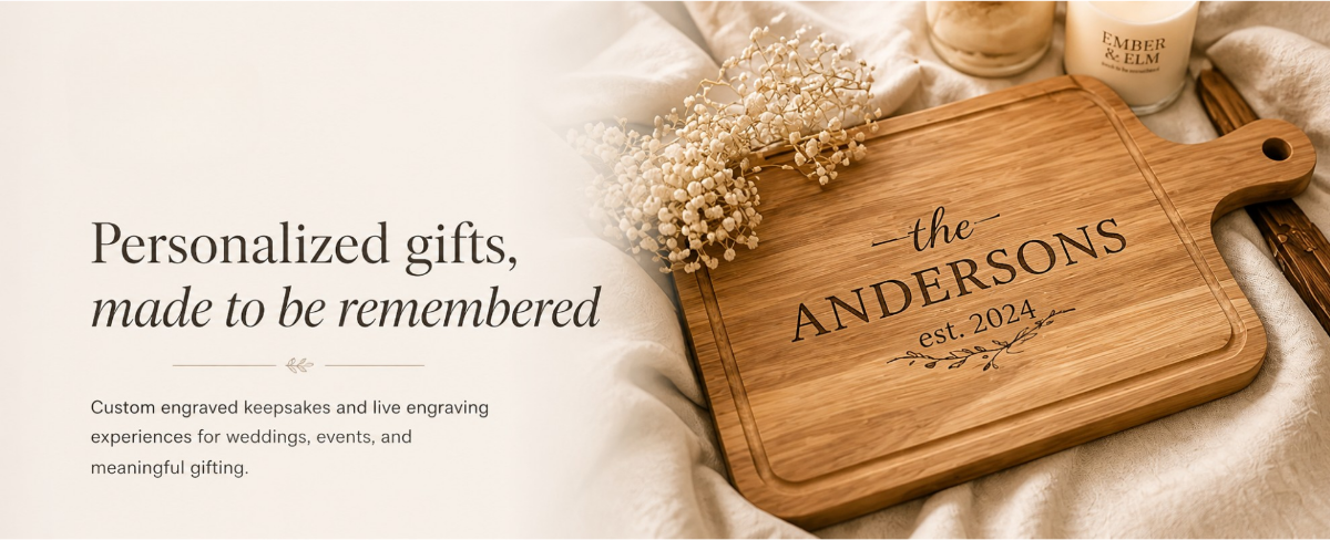 Wooden cutting board with engraved 'the ANDERSONS est 2024' on a soft background.